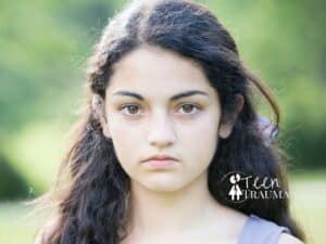 Youth Commercial Sexual Exploitation and Human Trafficking 5 Teen girl with serious expression, representing the emotional weight of trauma.